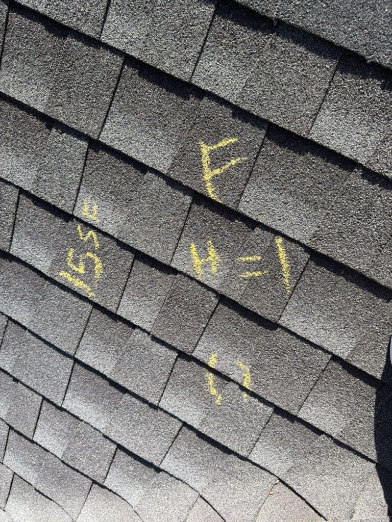 Hail test square on a Brighton roof with 11 hail hits marked in chalk, September 2026