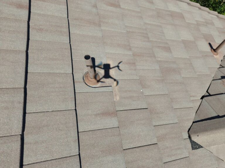 Pipe flashing on a concrete tile roof checked during a Castle Rock inspection