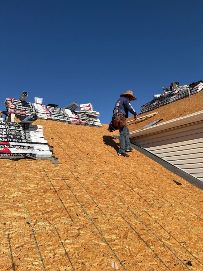 Watchdog crew on new roof decking during a Commerce City roof replacement