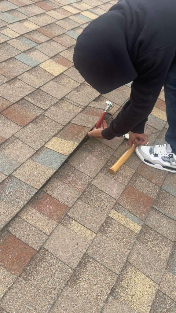 Shingle repair in progress on a Thornton roof, January 2026